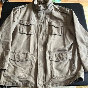 Distressed tan coat, perfect for doing yard work or fall weather activities.